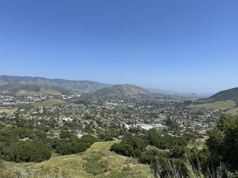 San Luis Obispo spread across its valley, seen from the hills above