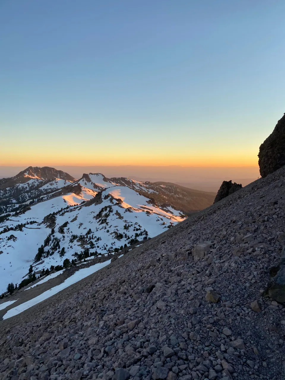Snow on the peaks at dusk