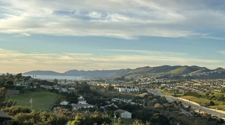 Hillside view over a Central Coast town toward the bay